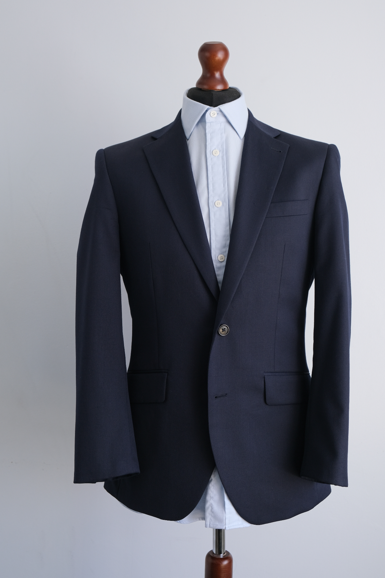 Navy suit jacket over a white shirt